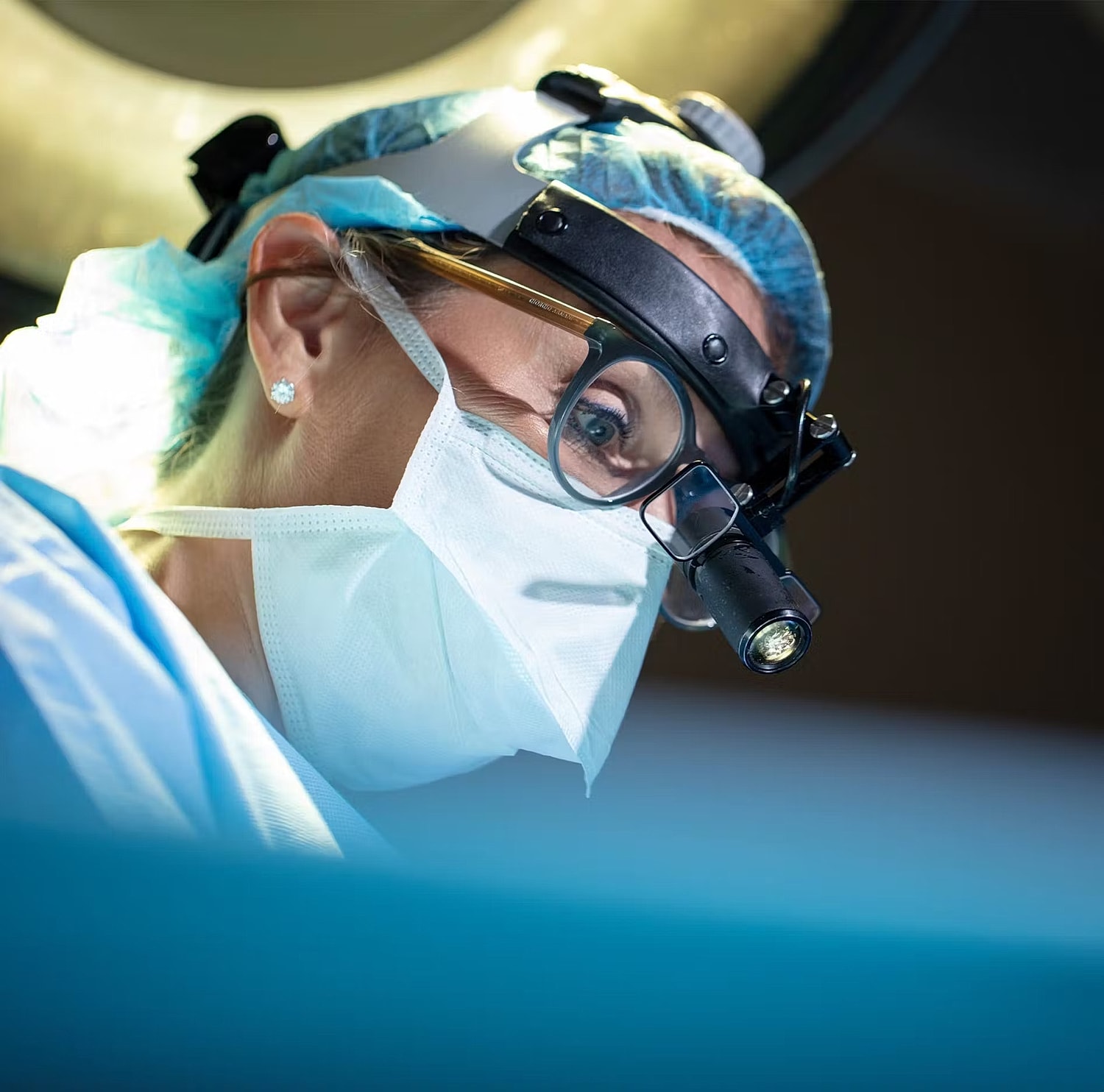 Model posing in a casual white outfit.