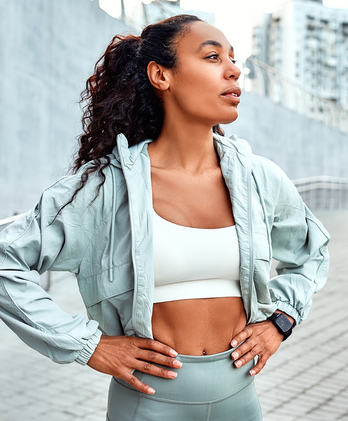 Model in brown swimwear posing confidently.