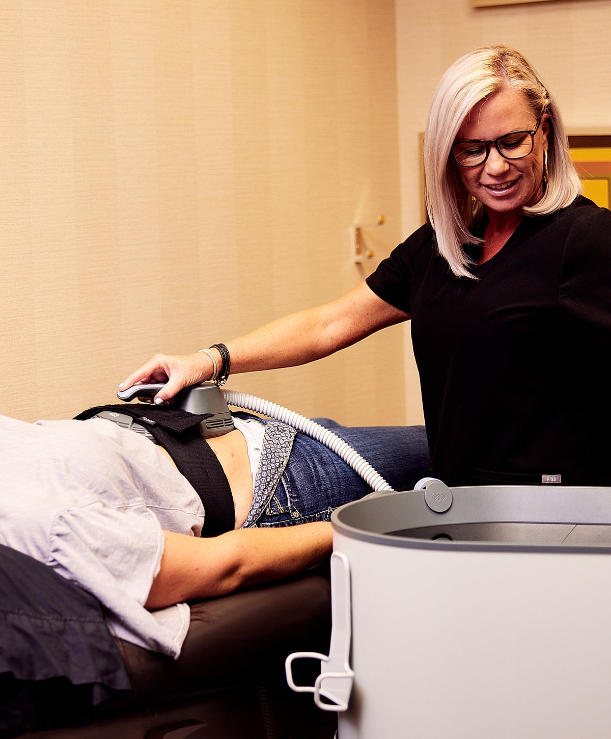 Model in brown swimwear posing confidently.