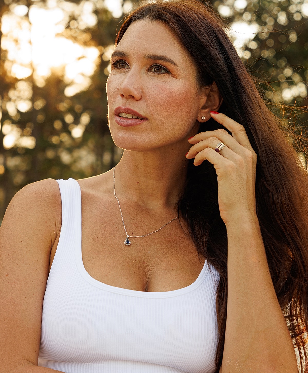 Model in brown swimwear posing confidently.