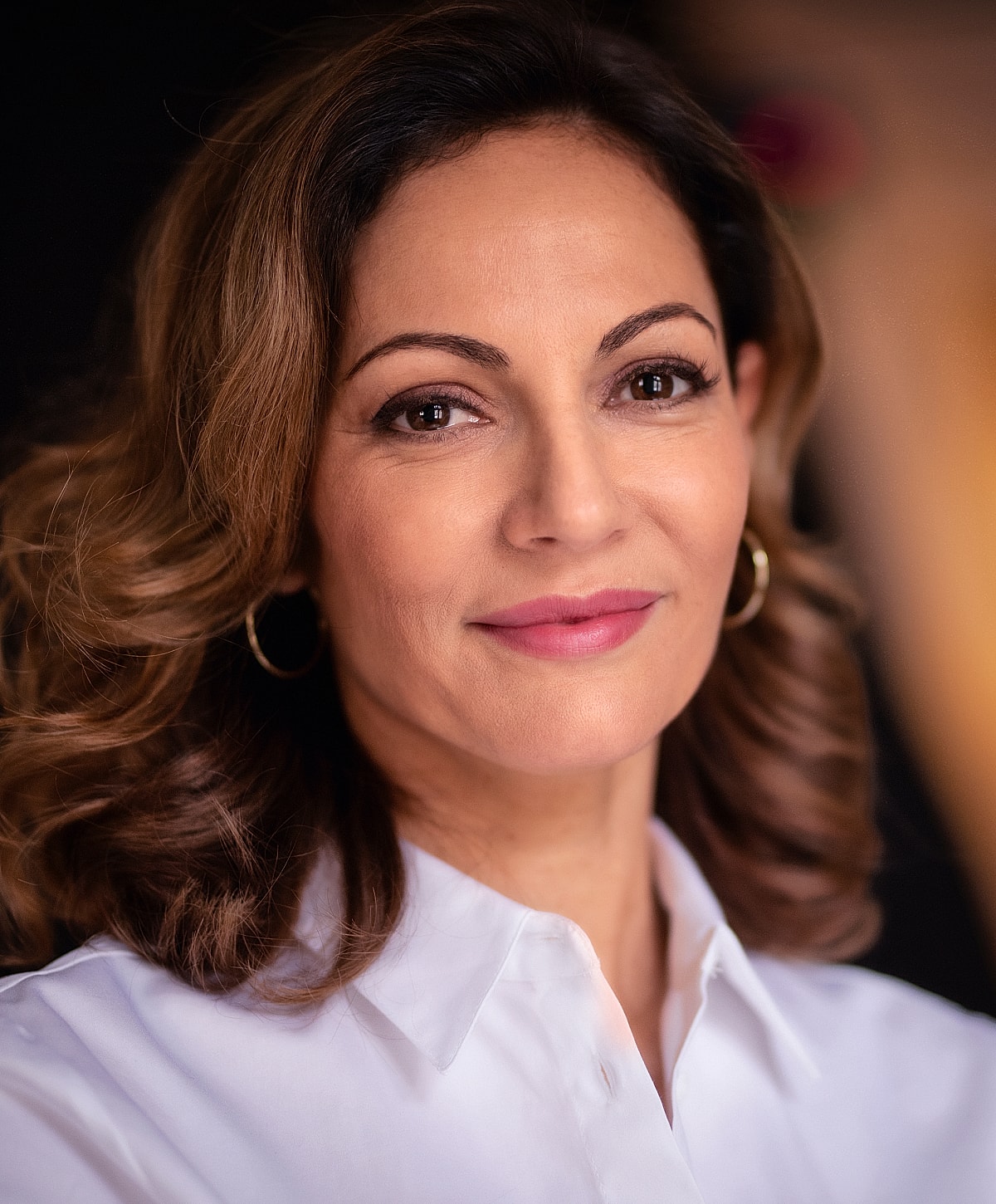 Model in brown swimwear posing confidently.