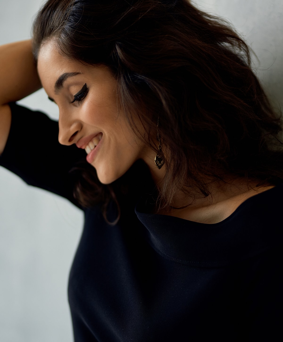 Model in brown swimwear posing confidently.