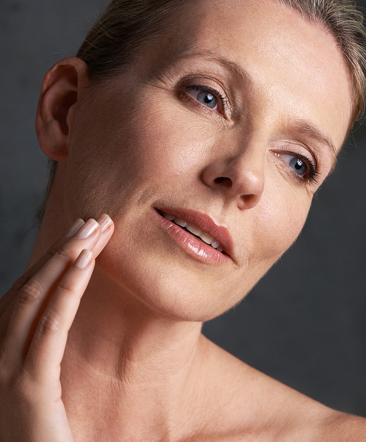 Model in brown swimwear posing confidently.
