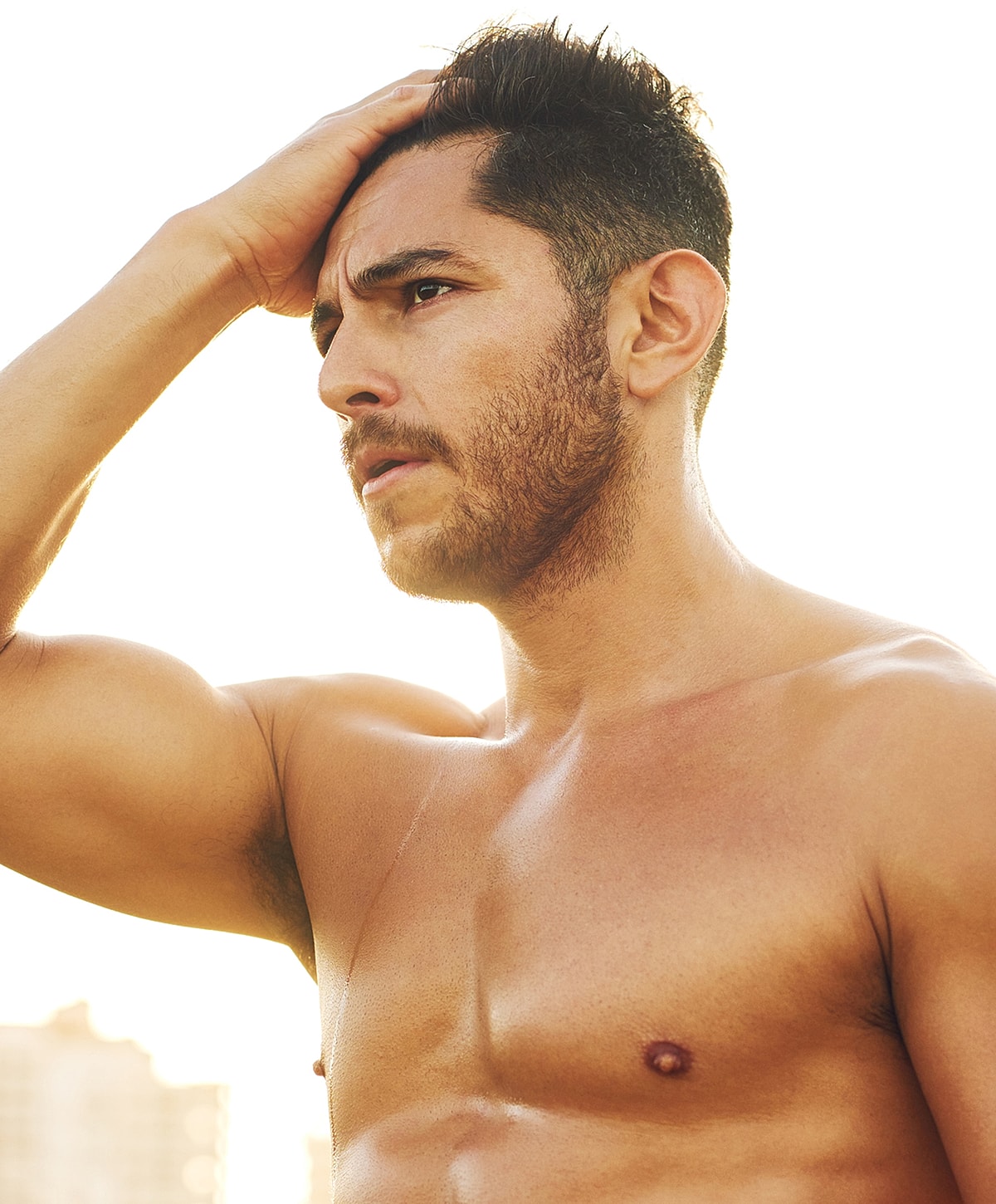 Model posing in a casual white outfit.