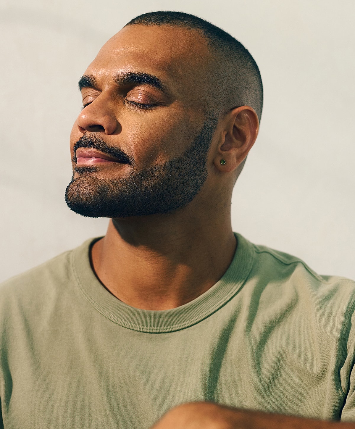 Model in brown swimwear posing confidently.