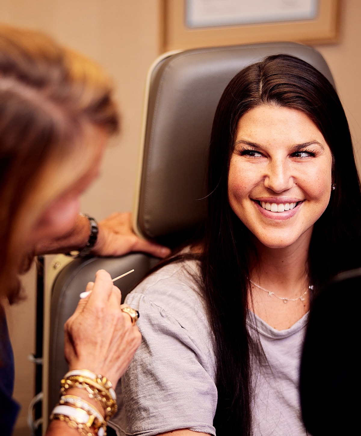 Model posing in a casual white outfit.