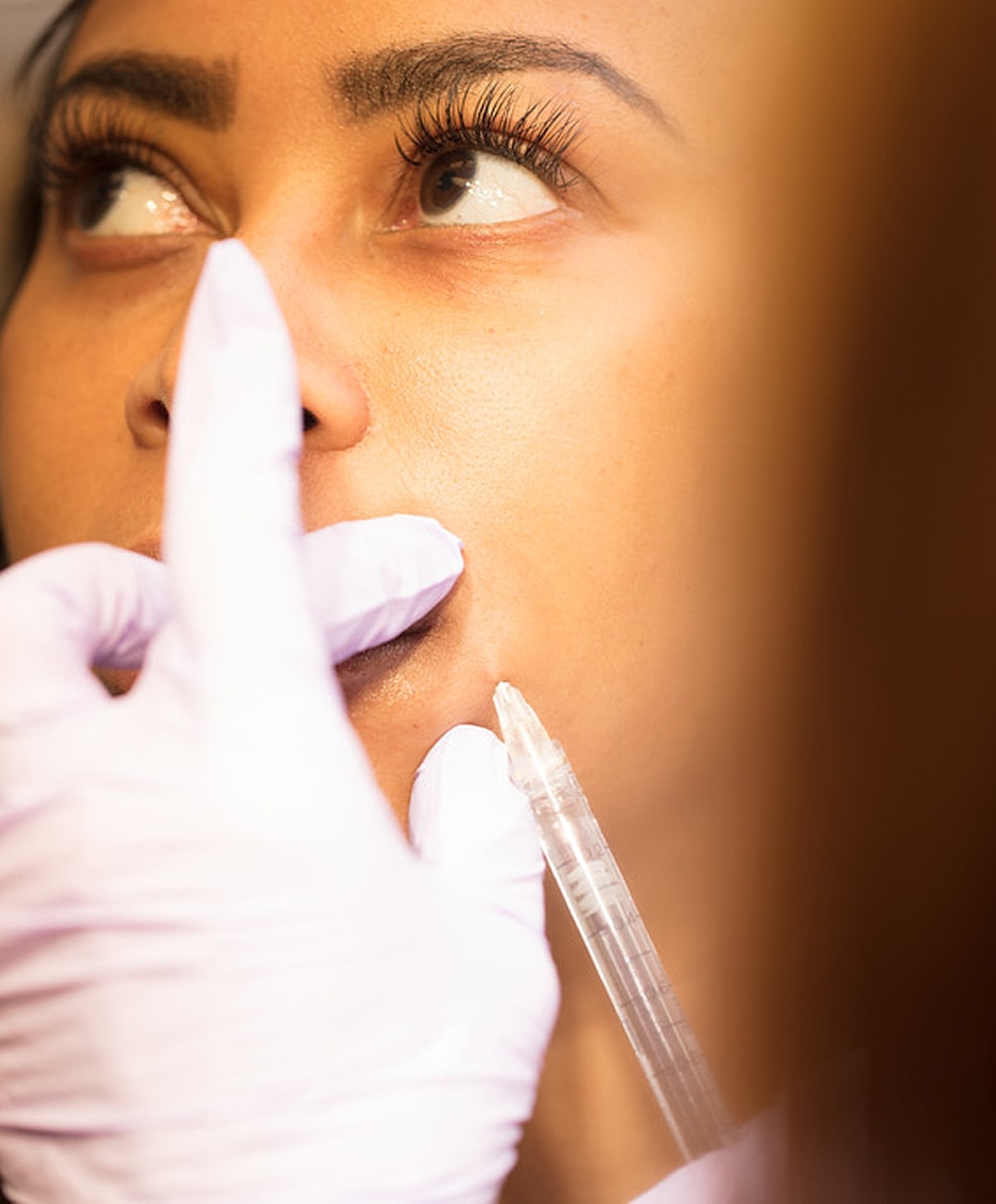 Model in brown swimwear posing confidently.