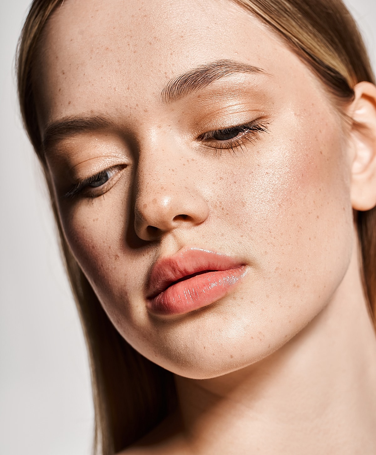 Model in brown swimwear posing confidently.