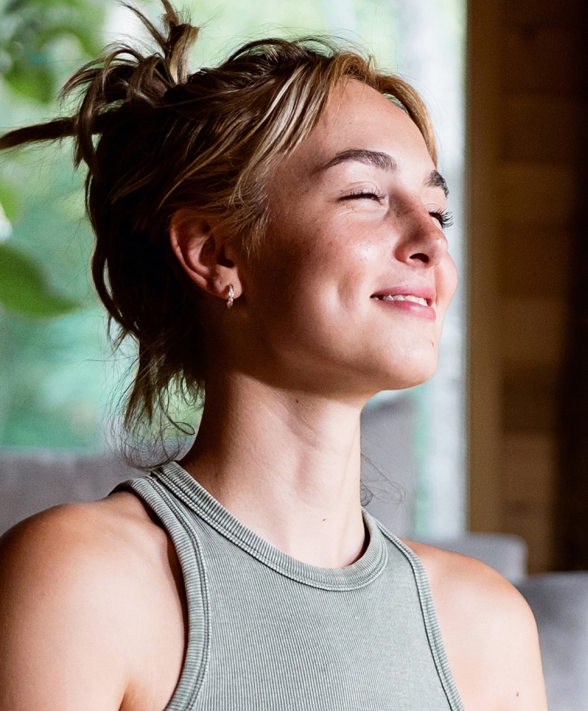 Smiling woman enjoying a moment of tranquility.