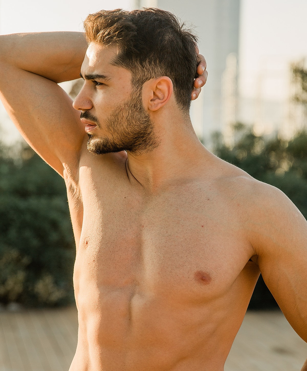 Model posing in a casual white outfit.