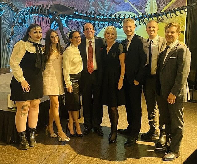 Group of people posing at an event.