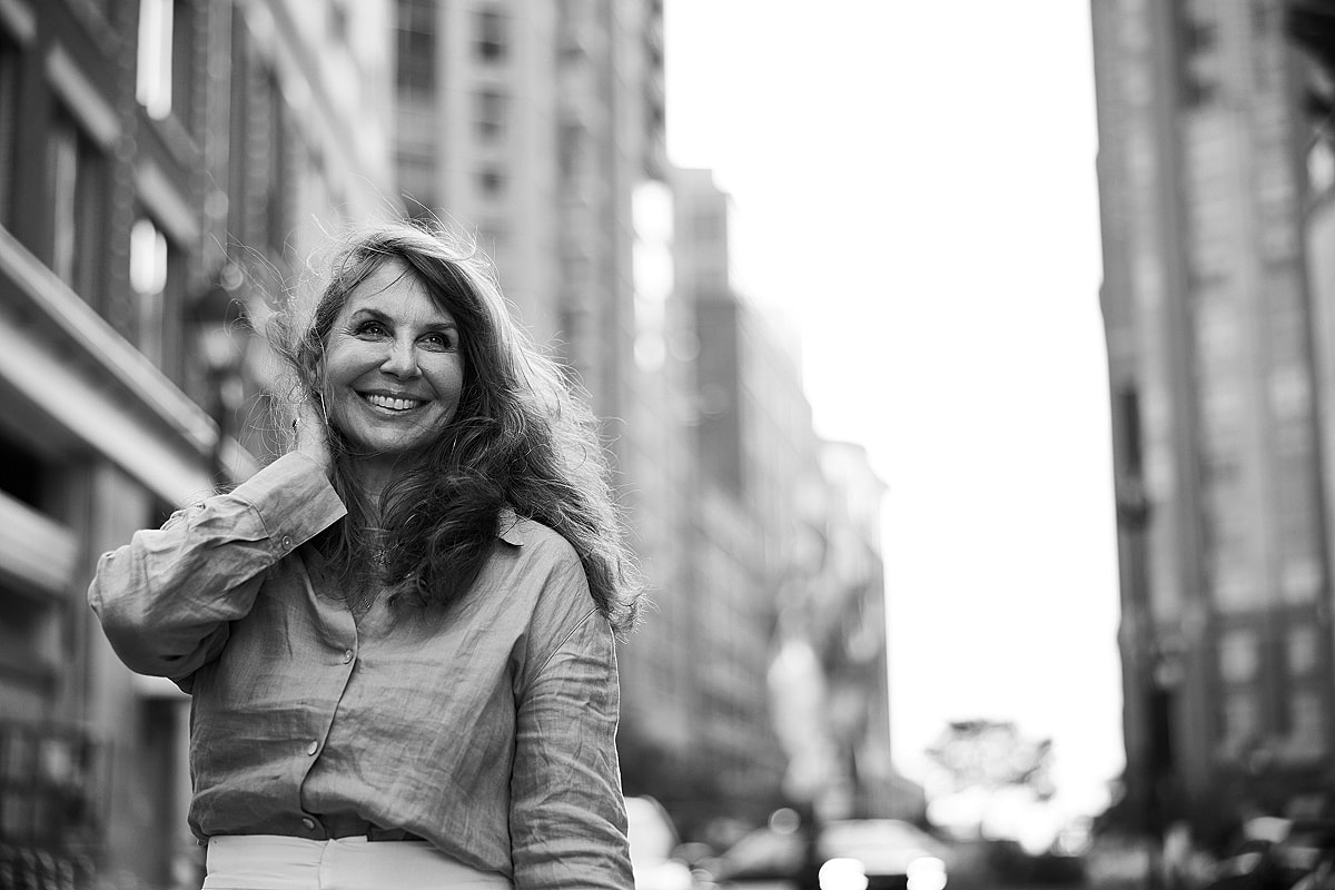 Model in brown swimwear posing confidently.