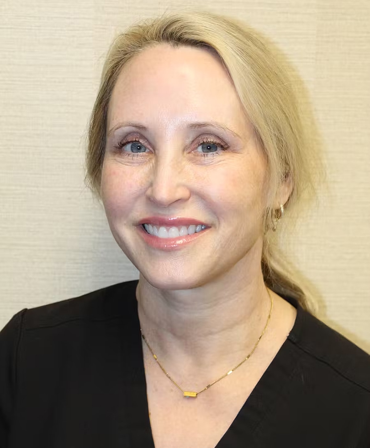 Model in brown swimwear posing confidently.