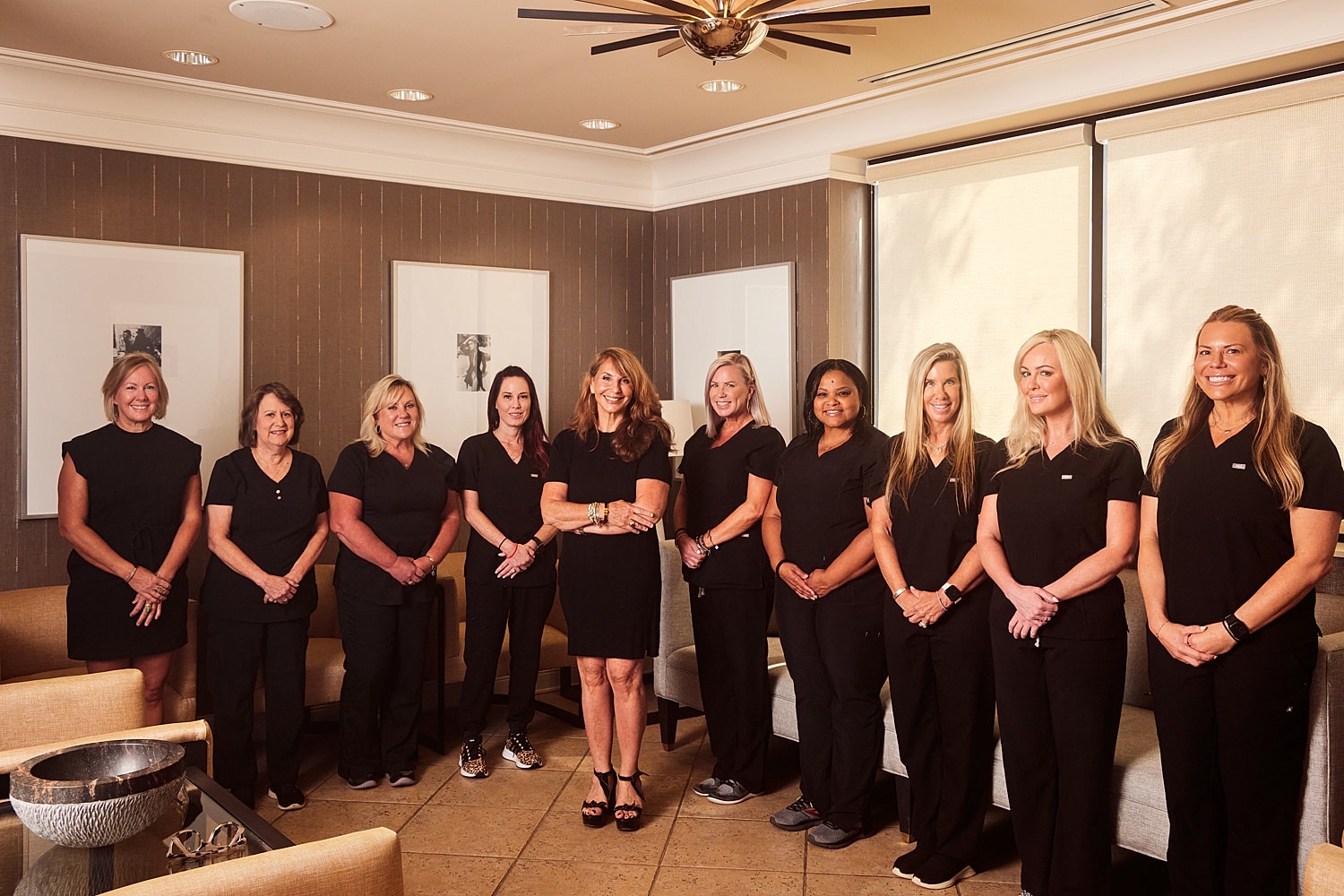 Model posing in a casual white outfit.