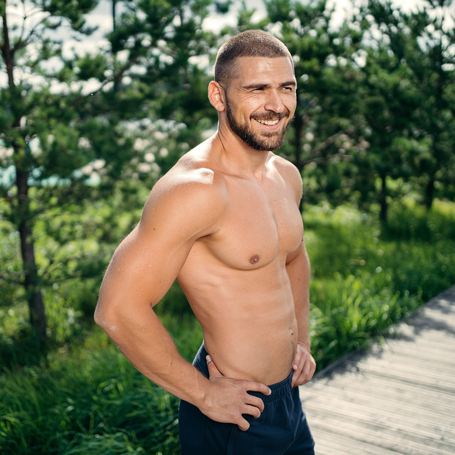 Model posing in a casual white outfit.