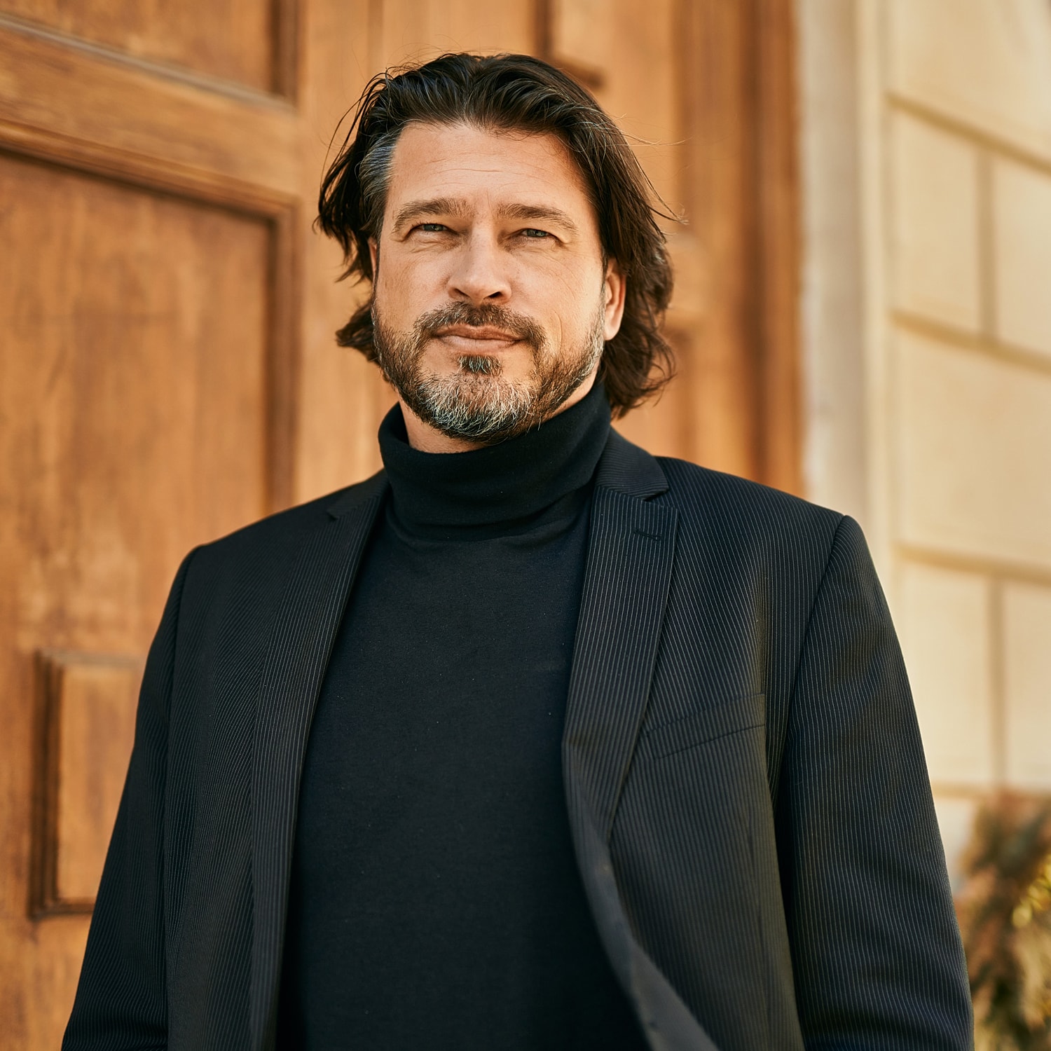 Model in brown swimwear posing confidently.