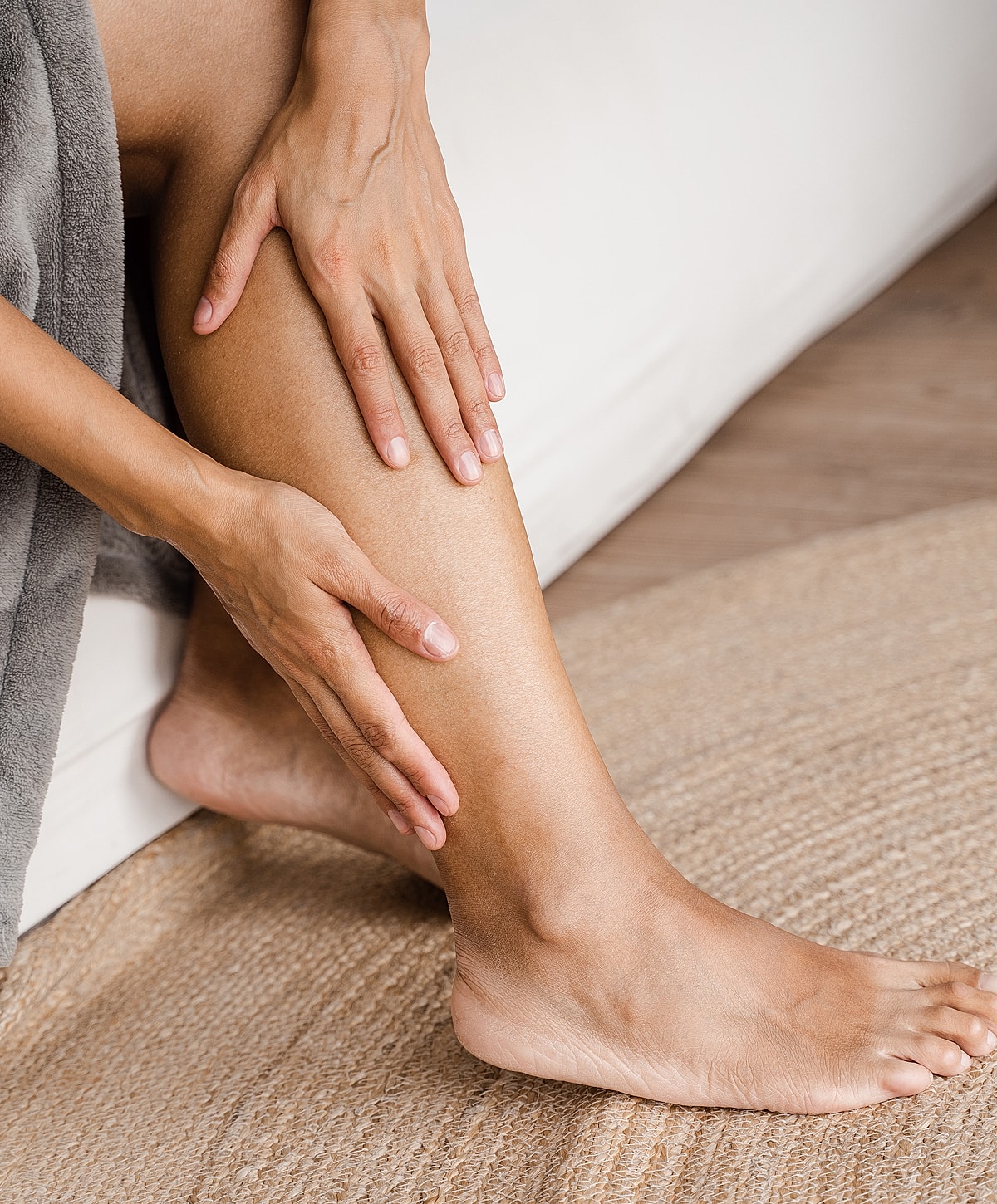 Model in brown swimwear posing confidently.