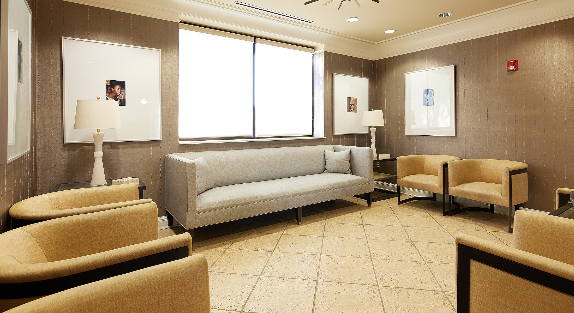 Modern waiting room with comfortable seating and decor.