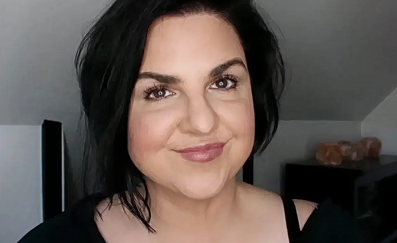 Woman speaking in an office setting.